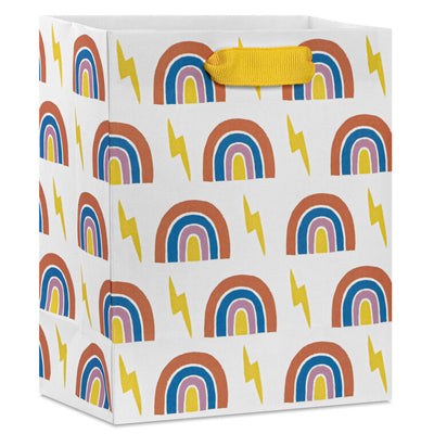 Small Hallmark gift bag with colorful rainbows and yellow lightning bolts on a white background with yellow ribbon handles.