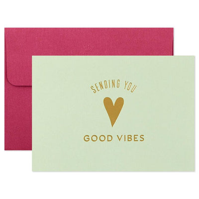 Assorted whimsical note cards with gold foil accents in multiple designs, includes envelopes and reusable caddy.