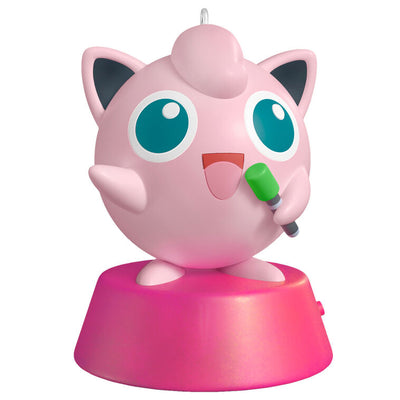 Hallmark Keepsake Pokémon Jigglypuff ornament, pink and round, singing into green microphone, with sound, on pink base.