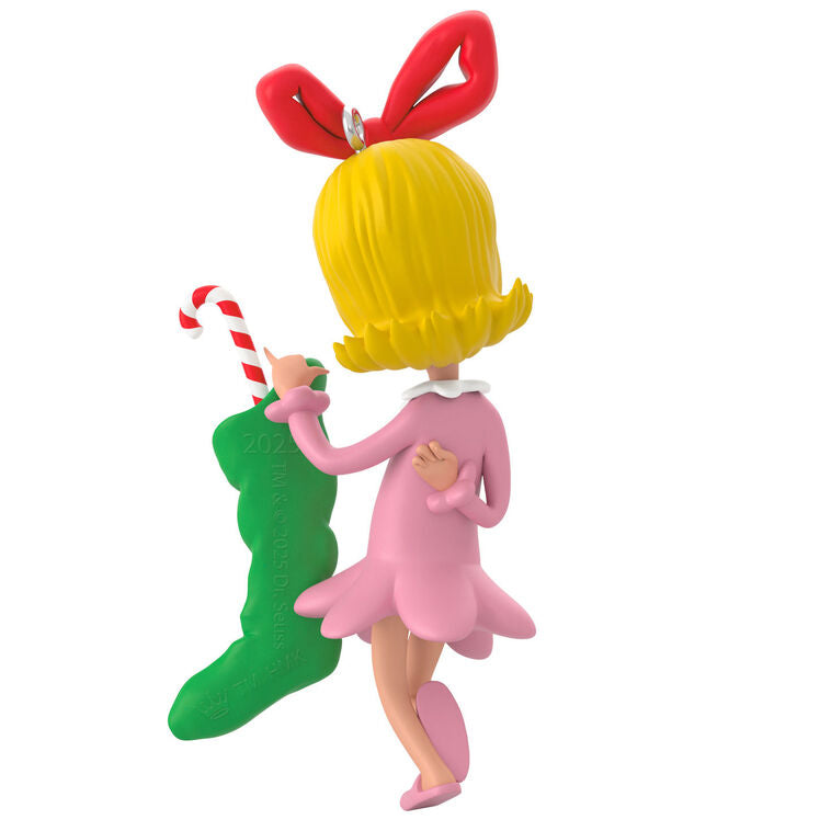 Hallmark Keepsake Dr. Seuss Cindy-Lou Who ornament, in pink nightgown, holding green stocking and candy cane, inspired by How the Grinch Stole Christmas.