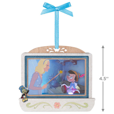 Disney Pinocchio 85th anniversary papercraft ornament with Blue Fairy and Geppetto’s puppet, lit with special effects.

