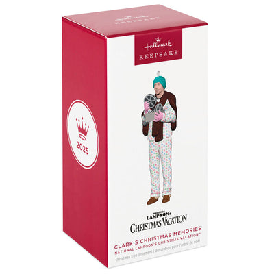 Hallmark Keepsake ornament of Clark Griswold in pajamas, fur stole, gloves, and turban holding a projector from National Lampoon's Christmas Vacation.