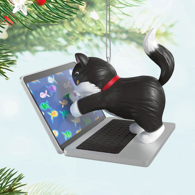 Hallmark Keepsake ornament of black-and-white tuxedo kitten playing with laptop showing colorful fish, Mischievous Kittens series