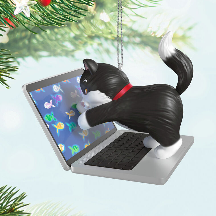Hallmark Keepsake ornament of black-and-white tuxedo kitten playing with laptop showing colorful fish, Mischievous Kittens series
