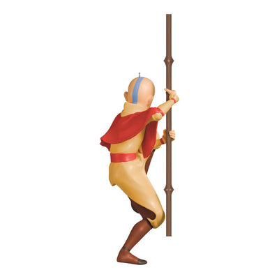 Christmas ornament of Aang from Avatar: The Last Airbender holding his staff in a defensive pose with arrow tattoo on forehead.