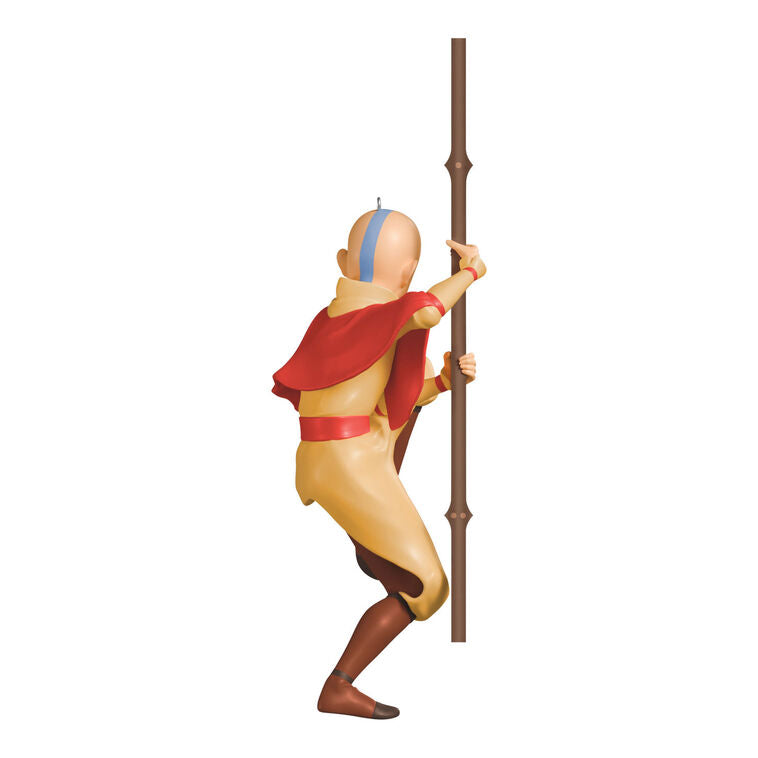 Christmas ornament of Aang from Avatar: The Last Airbender holding his staff in a defensive pose with arrow tattoo on forehead.