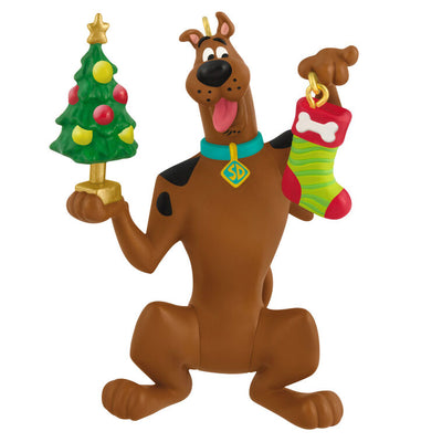 Hallmark Keepsake Tom and Jerry ornament featuring Tom the cat holding Jerry the mouse as a sandwich, with a red napkin tied around his neck.