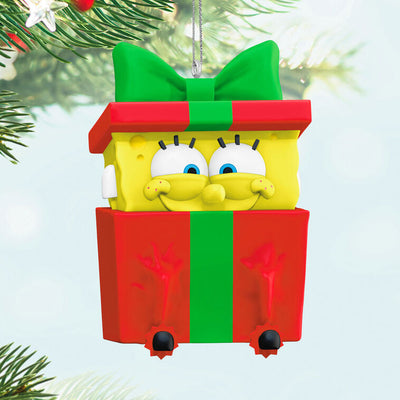 SpongeBob SquarePants ornament, yellow character in red gift box with green bow, Hallmark Keepsake, Christmas tree decoration.