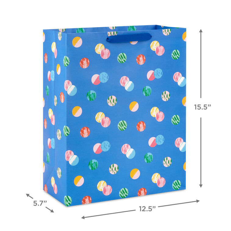 Hallmark extra-large gift bag with playful polka dots on a blue background, ideal for birthdays, holidays, or celebrations.