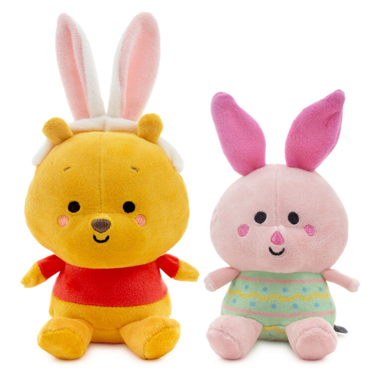 Disney plush Pooh in bunny ears and Piglet in an Easter egg outfit with magnetic connectors for spring gifting.
