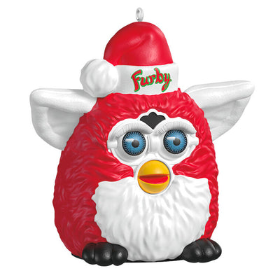 Festive Furby ornament, red and white electronic toy with blue eyes, yellow beak, Santa hat, Hallmark Keepsake, Christmas decoration.
