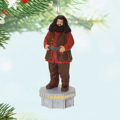 Hallmark Keepsake ornament of Hagrid from Harry Potter, standing on stone base with red coat, light and sound Chamber of Secrets Collection