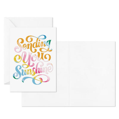 White blank note cards with colorful embossed “Sending You Sunshine” lettering in pink, orange, yellow, blue, and green.
