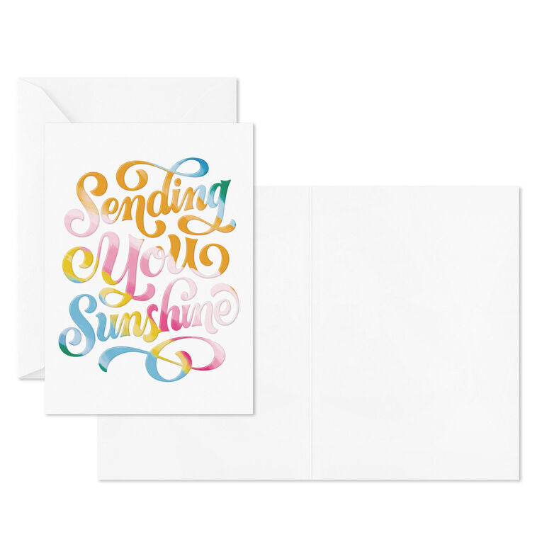 White blank note cards with colorful embossed “Sending You Sunshine” lettering in pink, orange, yellow, blue, and green.
