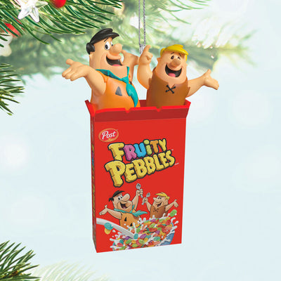 Hallmark Keepsake The Flintstones Fruity Pebbles ornament featuring Fred Flintstone and Barney Rubble in a red Fruity Pebbles cereal box.