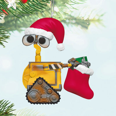 Wall-E Christmas ornament wearing Santa hat and holding red holiday stocking with a gift
