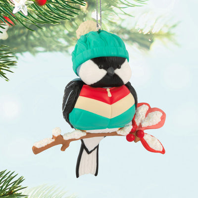 Hallmark Keepsake Cozy Critters ornament—black-capped chickadee in teal stocking hat and striped vest perched on holly branch with glittery snow