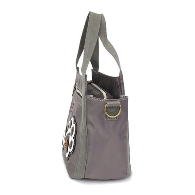 Venture Mini Carryall Pawprint Chala Pal design with antique brass embellishments, RFID credit card slots, dual-sided design, and adjustable shoulder straps.