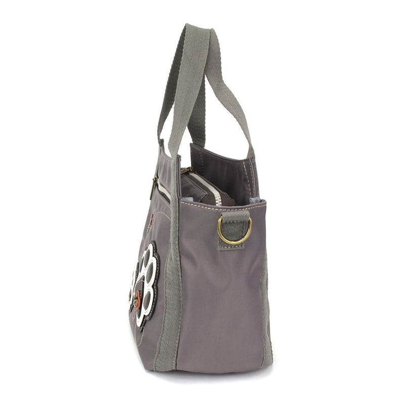Venture Mini Carryall Pawprint Chala Pal design with antique brass embellishments, RFID credit card slots, dual-sided design, and adjustable shoulder straps.