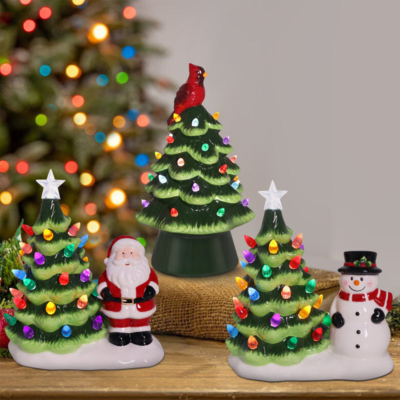 Glossy green ceramic LED Christmas tree with multicolor lights and red cardinal bird topper.