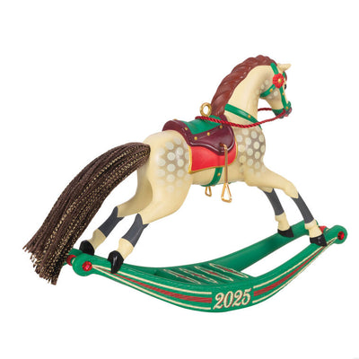 Hallmark Keepsake Rocking Horse Memories 2025 ornament—cream horse, brown mane and tail, red saddle, green sled base, red flower accents, year dated
