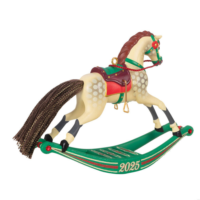 Hallmark Keepsake Rocking Horse Memories 2025 ornament—cream horse, brown mane and tail, red saddle, green sled base, red flower accents, year dated
