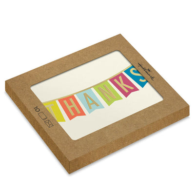 Thank-you cards with colorful pennant banner letters and gold foil on an off-white background.
