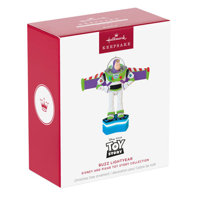 Buzz Lightyear Christmas ornament with wings extended on blue base, featuring light and sound effects