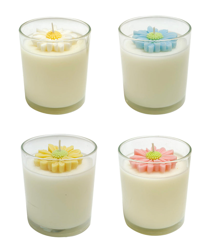 Opportunities 10 oz daisy candle in floral container, featuring soft fragrance and decorative daisy-themed design.