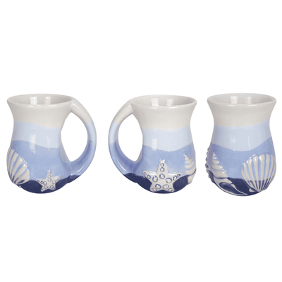Opportunities 16 oz Seaside Serenity mug featuring coastal seashell design with a cozy handle and beach-inspired charm.