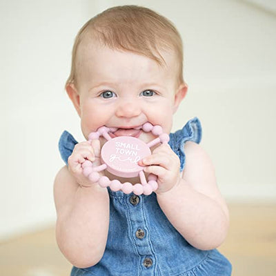 Round silicone teether with 'Small Town Girl' message and beaded edges, designed to soothe baby gums and support sensory.