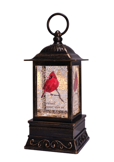 Bronze lantern with cardinal perched on branch, bereavement quote, glitter, and soft LED light.
