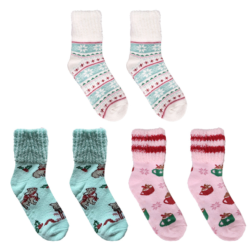 Assorted fuzzy socks in pink, teal, and neutral tones with cocoa mugs and snowflake patterns.