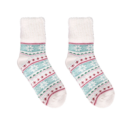Assorted fuzzy socks in pink, teal, and neutral tones with cocoa mugs and snowflake patterns.