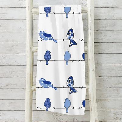 Bluebird themed fleece blanket with floral pattern measuring 50 by 60 inches