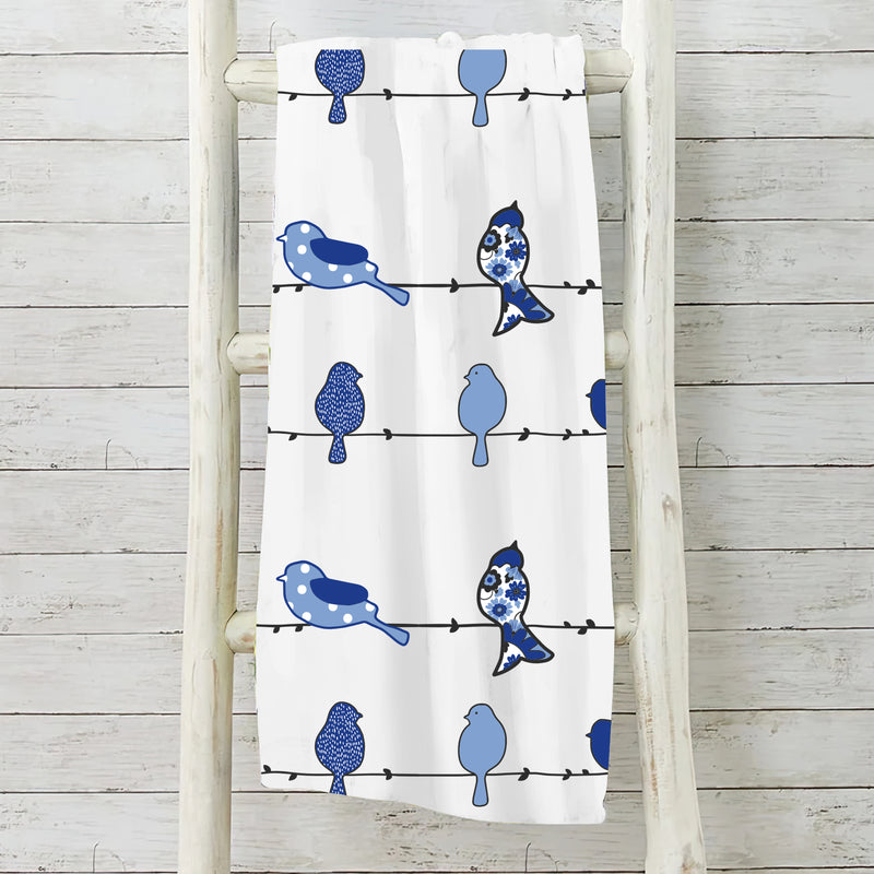 Bluebird themed fleece blanket with floral pattern measuring 50 by 60 inches