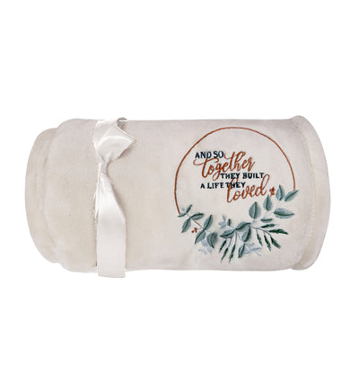 Cozy beige fleece blanket with heartfelt quote and simple design
