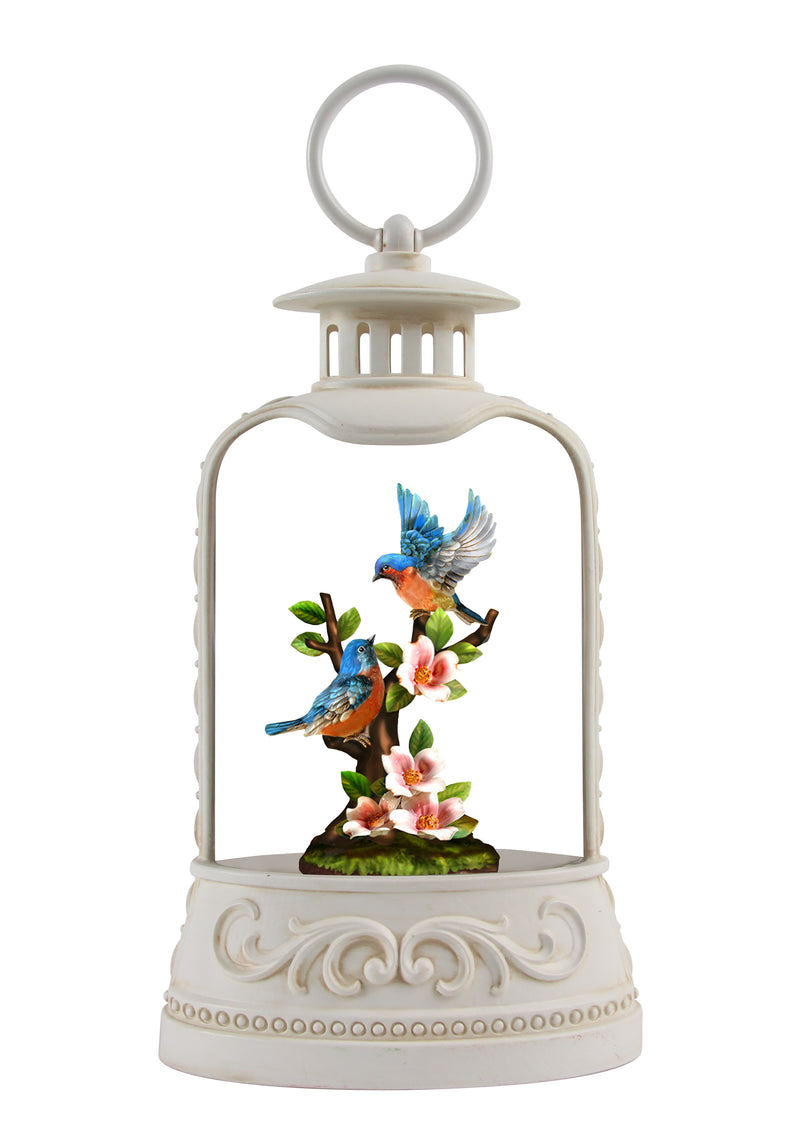 Battery operated glitter lantern with blooming flowers and cheerful bluebirds
