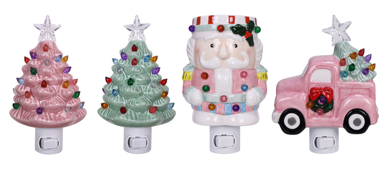 Assorted ceramic night lights with sugarplum designs including pink Christmas trees, Santa, and a festive red truck.