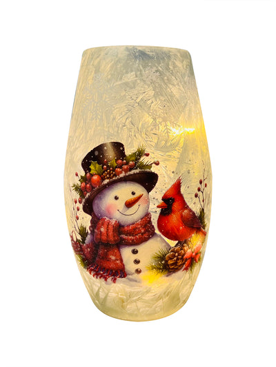 Frosted crackle glass vase with cheerful snowman and red cardinal design, softly lit by built-in LED.