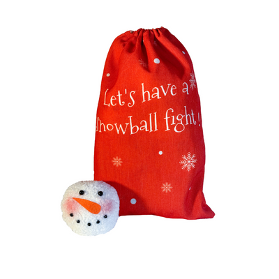 Red drawstring bag labeled “Let’s have a snowball fight” with soft plush snowballs featuring snowman faces.