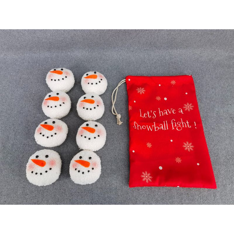 Red drawstring bag labeled “Let’s have a snowball fight” with soft plush snowballs featuring snowman faces.