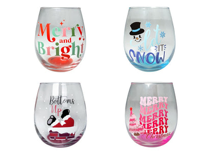 Clear stemless wine glass with red and green “Merry and Bright” lettering and festive holiday accents.