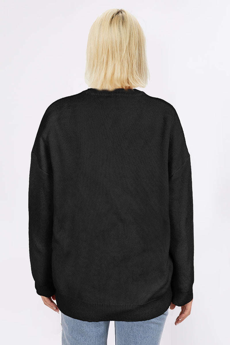 Black sweater with oversized gold sequin bow across the chest, displayed on mannequin