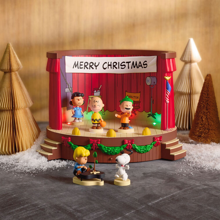 Peanuts tabletop Christmas decoration featuring Charlie Brown and friends on stage with lights and sound effects from A Charlie

