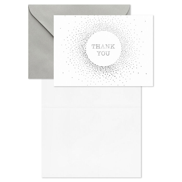White thank-you cards with silver foil dots radiating from center text and matching envelopes.
