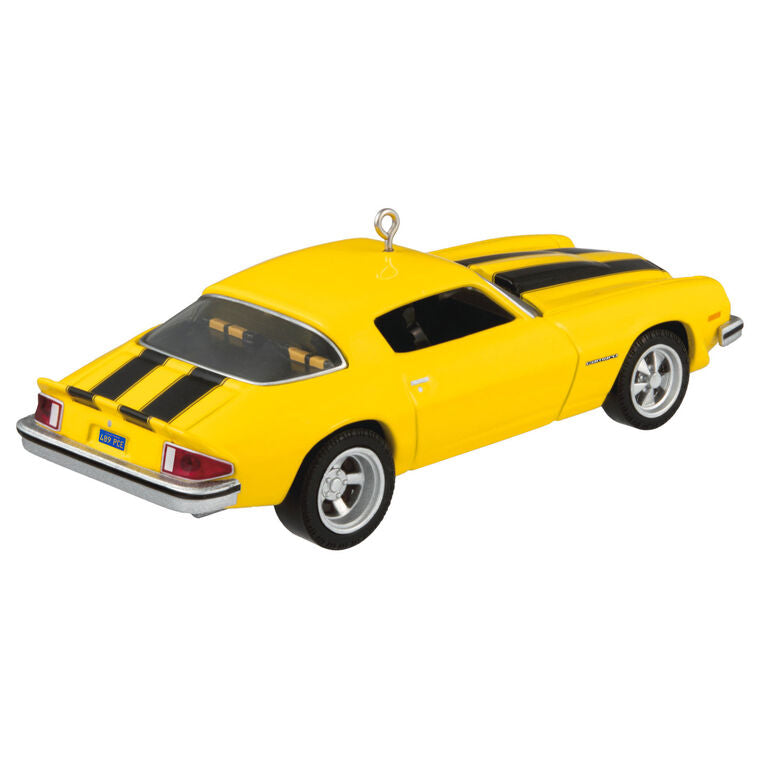 Yellow and black 1976 Chevrolet Camaro ornament from Transformers with turning wheels, representing Bumblebee in Earth vehicle disguise.