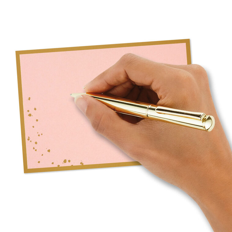 Pink flat note cards with gold foil frame and splatter dot accents, bundled in a kraft wrap.
