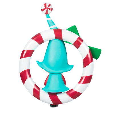 Hallmark Keepsake Sweet Peppermint girl gnome ornament in red and blue, sitting on candy cane wreath with green bow.