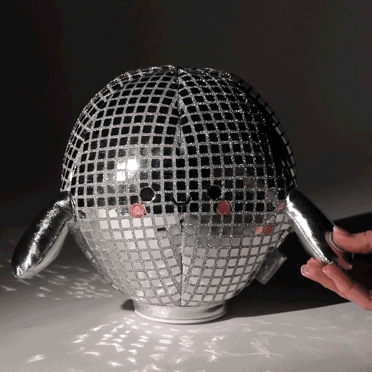 Smiling plush disco ball with silver sequins and arms, spins and plays &